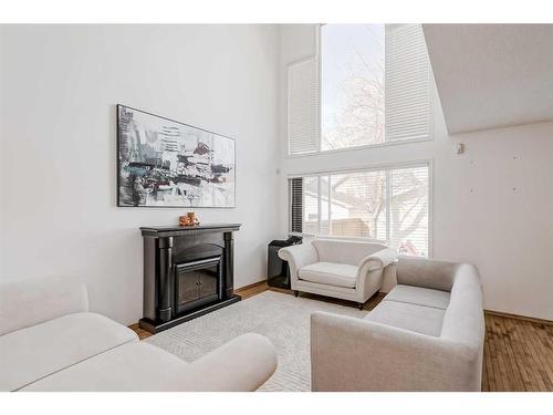 89 Cramond Crescent Se, Calgary, AB - Indoor Photo Showing Living Room With Fireplace