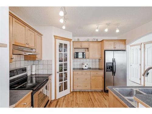 89 Cramond Crescent Se, Calgary, AB - Indoor Photo Showing Kitchen With Double Sink