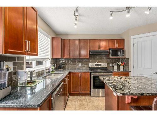 267 Silverado Drive Sw, Calgary, AB - Indoor Photo Showing Kitchen With Double Sink