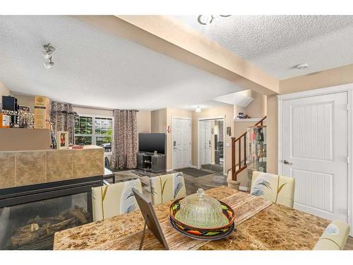 267 Silverado Drive Sw, Calgary, AB - Indoor Photo Showing Living Room With Fireplace