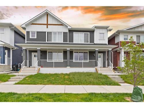 233 & 237, 225 & 229 Creekside Drive Sw, Calgary, AB - Outdoor With Deck Patio Veranda With Facade