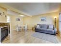 106 Woodborough Terrace Sw, Calgary, AB  - Indoor Photo Showing Living Room With Fireplace 