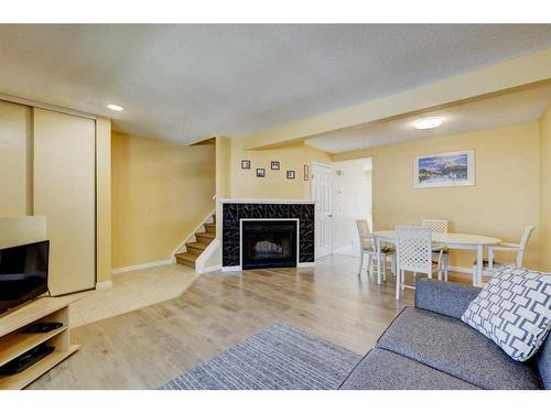 106 Woodborough Terrace Sw, Calgary, AB - Indoor With Fireplace