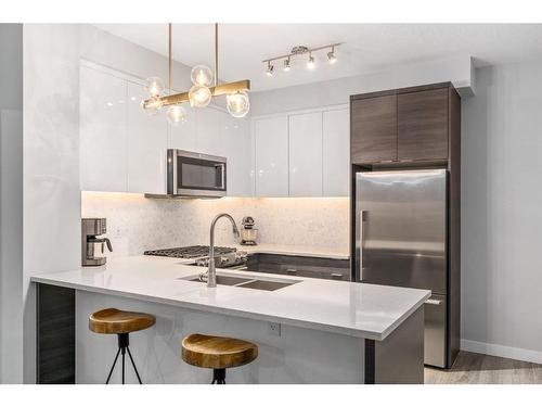 3117-95 Burma Star Road Sw, Calgary, AB - Indoor Photo Showing Kitchen With Stainless Steel Kitchen With Double Sink With Upgraded Kitchen