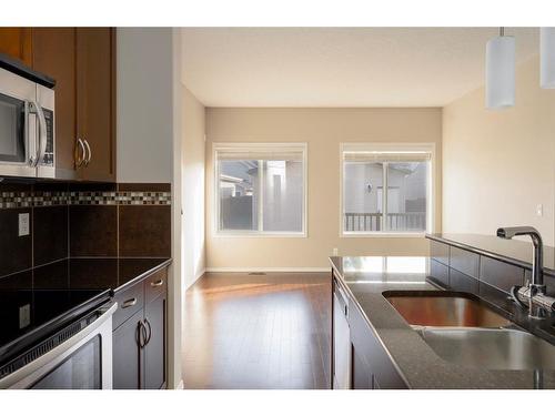 149 Cranford Drive Se, Calgary, AB - Indoor Photo Showing Kitchen With Double Sink