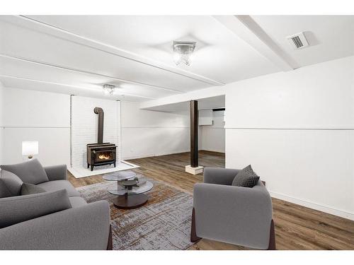 4832 Worcester Drive Sw, Calgary, AB - Indoor Photo Showing Living Room With Fireplace