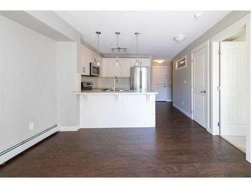 202-130 Auburn Meadows View Se, Calgary, AB - Indoor Photo Showing Kitchen With Double Sink