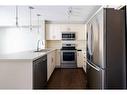 202-130 Auburn Meadows View Se, Calgary, AB  - Indoor Photo Showing Kitchen With Stainless Steel Kitchen With Double Sink With Upgraded Kitchen 