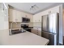 202-130 Auburn Meadows View Se, Calgary, AB  - Indoor Photo Showing Kitchen With Stainless Steel Kitchen With Double Sink With Upgraded Kitchen 