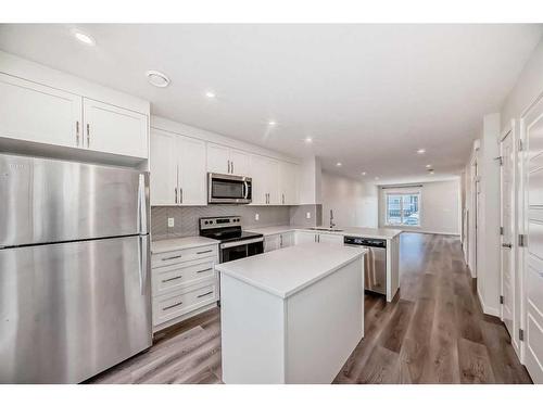 118-260 Rowley Way Nw, Calgary, AB - Indoor Photo Showing Kitchen With Upgraded Kitchen