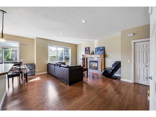 24 Copperstone Place Se, Calgary, AB - Indoor Photo Showing Living Room With Fireplace