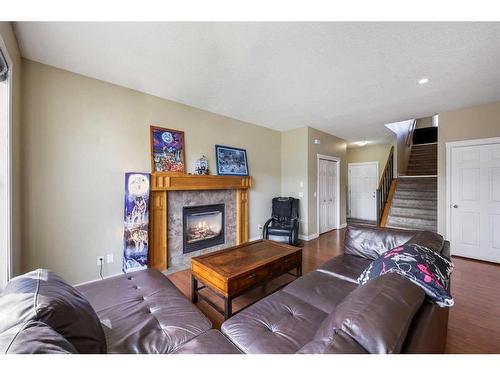 24 Copperstone Place Se, Calgary, AB - Indoor Photo Showing Living Room With Fireplace