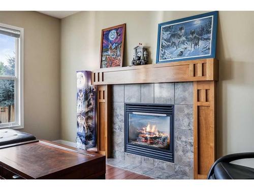 24 Copperstone Place Se, Calgary, AB - Indoor Photo Showing Living Room With Fireplace