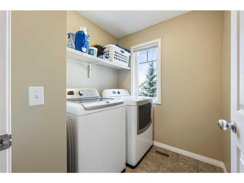 24 Copperstone Place Se, Calgary, AB - Indoor Photo Showing Laundry Room