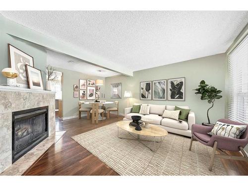 141 Woodborough Terrace Sw, Calgary, AB - Indoor Photo Showing Living Room With Fireplace