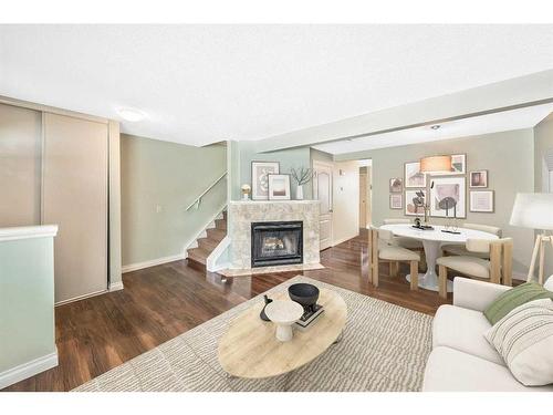 141 Woodborough Terrace Sw, Calgary, AB - Indoor Photo Showing Living Room With Fireplace