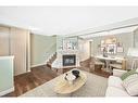 141 Woodborough Terrace Sw, Calgary, AB  - Indoor Photo Showing Living Room With Fireplace 