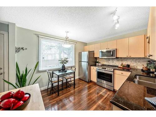 141 Woodborough Terrace Sw, Calgary, AB - Indoor Photo Showing Kitchen With Stainless Steel Kitchen With Double Sink