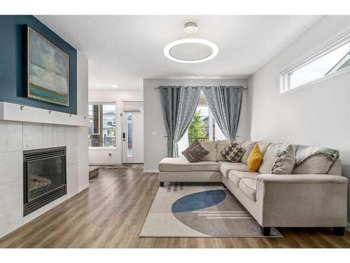 853 West Lakeview Drive, Chestermere, AB - Indoor Photo Showing Living Room With Fireplace