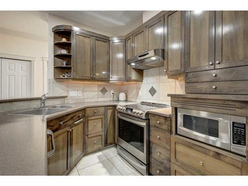 1208-24 Hemlock Crescent Sw, Calgary, AB - Indoor Photo Showing Kitchen With Double Sink