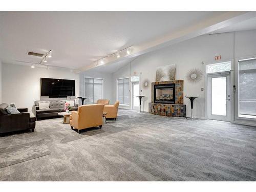 1208-24 Hemlock Crescent Sw, Calgary, AB - Indoor Photo Showing Living Room With Fireplace