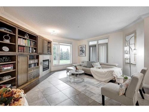 1208-24 Hemlock Crescent Sw, Calgary, AB - Indoor Photo Showing Living Room With Fireplace