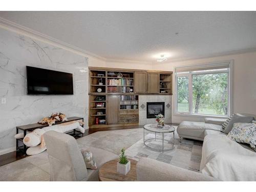 1208-24 Hemlock Crescent Sw, Calgary, AB - Indoor Photo Showing Living Room With Fireplace