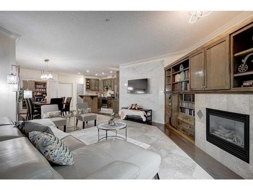 1208-24 Hemlock Crescent Sw, Calgary, AB - Indoor Photo Showing Living Room With Fireplace