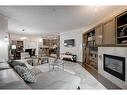 1208-24 Hemlock Crescent Sw, Calgary, AB  - Indoor Photo Showing Living Room With Fireplace 