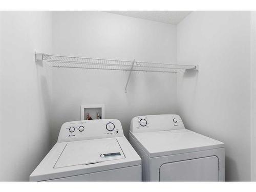 300 Dawson Drive, Chestermere, AB - Indoor Photo Showing Laundry Room