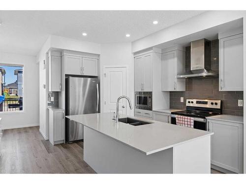 300 Dawson Drive, Chestermere, AB - Indoor Photo Showing Kitchen With Stainless Steel Kitchen With Double Sink With Upgraded Kitchen