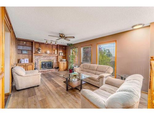 60 Patterson Hill Sw, Calgary, AB - Indoor Photo Showing Living Room With Fireplace