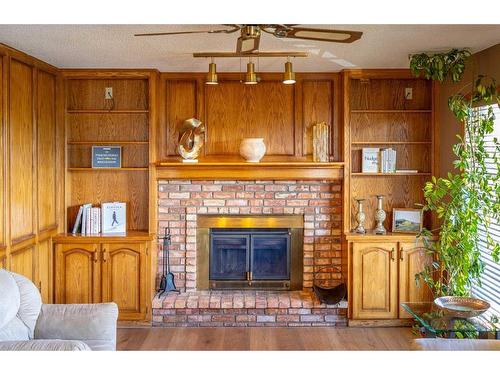 60 Patterson Hill Sw, Calgary, AB - Indoor Photo Showing Living Room With Fireplace