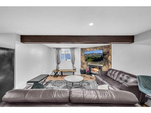 7030 Temple Drive Ne, Calgary, AB - Indoor Photo Showing Living Room With Fireplace