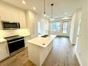 2220-395 Skyview Parkway Ne, Calgary, AB  - Indoor Photo Showing Kitchen With Double Sink 