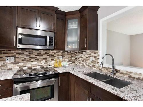 90 Country Hills Cove Nw, Calgary, AB - Indoor Photo Showing Kitchen With Double Sink With Upgraded Kitchen