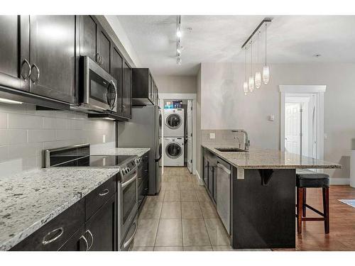 209-201 20 Avenue Ne, Calgary, AB - Indoor Photo Showing Kitchen With Upgraded Kitchen