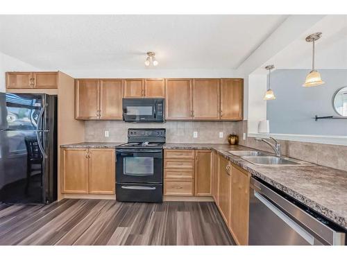 129 Elgin Meadows View Se, Calgary, AB - Indoor Photo Showing Kitchen With Double Sink