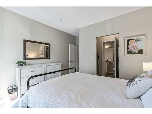 201-16 Poplar Avenue, Okotoks, AB - Indoor Photo Showing Bedroom