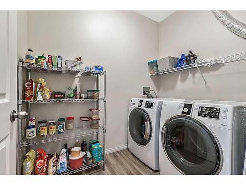 201-16 Poplar Avenue, Okotoks, AB - Indoor Photo Showing Laundry Room