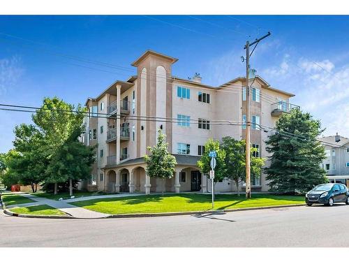 201-16 Poplar Avenue, Okotoks, AB - Outdoor With Facade