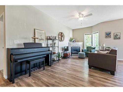 201-16 Poplar Avenue, Okotoks, AB - Indoor Photo Showing Living Room With Fireplace