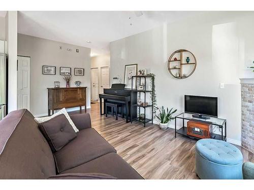 201-16 Poplar Avenue, Okotoks, AB - Indoor Photo Showing Living Room