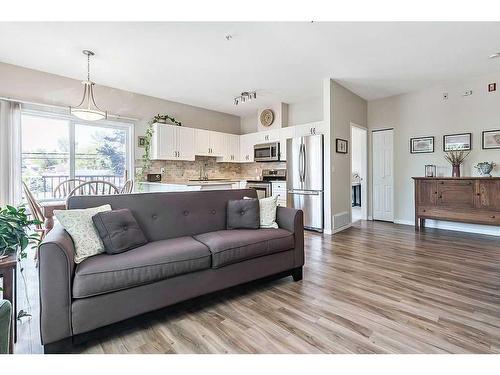 201-16 Poplar Avenue, Okotoks, AB - Indoor Photo Showing Living Room