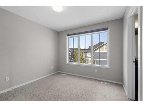 1412-125 Panatella Way Nw, Calgary, AB - Indoor Photo Showing Other Room