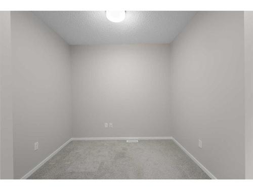 1412-125 Panatella Way Nw, Calgary, AB - Indoor Photo Showing Other Room