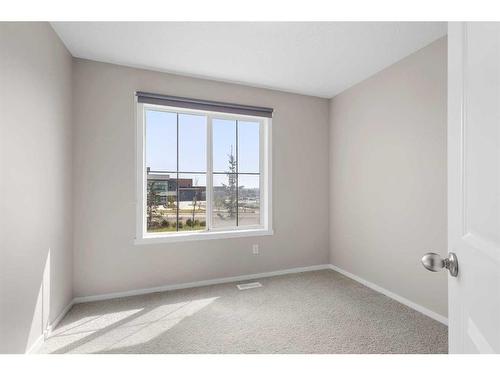 1412-125 Panatella Way Nw, Calgary, AB - Indoor Photo Showing Other Room