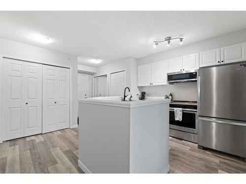 402-1121 6 Avenue Sw, Calgary, AB - Indoor Photo Showing Kitchen With Stainless Steel Kitchen