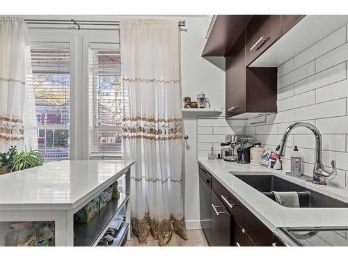 104-323 18 Avenue Sw, Calgary, AB - Indoor Photo Showing Kitchen With Double Sink With Upgraded Kitchen