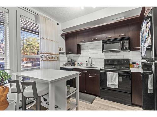 104-323 18 Avenue Sw, Calgary, AB - Indoor Photo Showing Kitchen